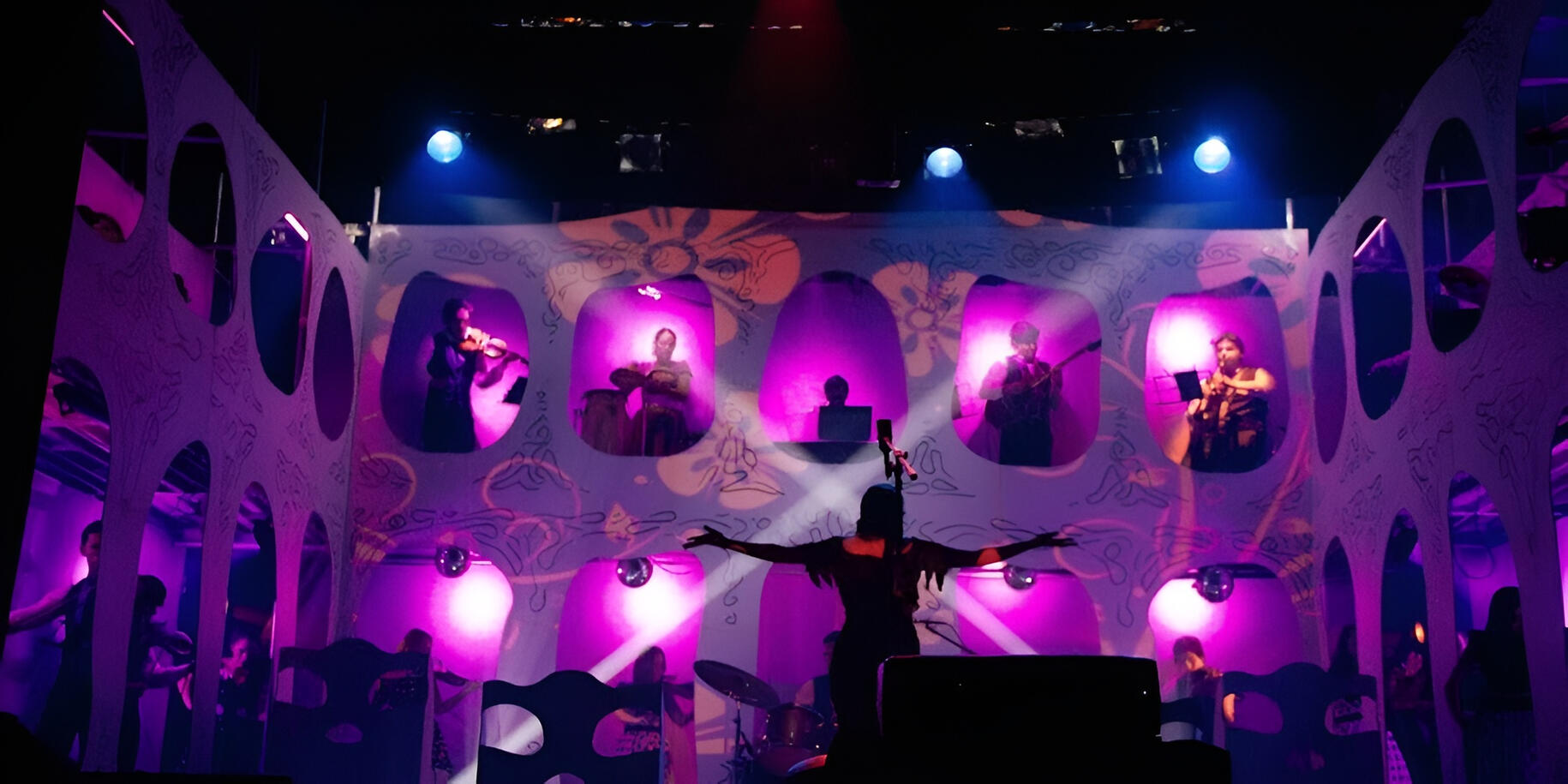 Performance with the Camerata del Oriente Everton Vidal Azevedo performing with the Camerata del Oriente in a stage production with illuminated multi-window set design (Cambópera).